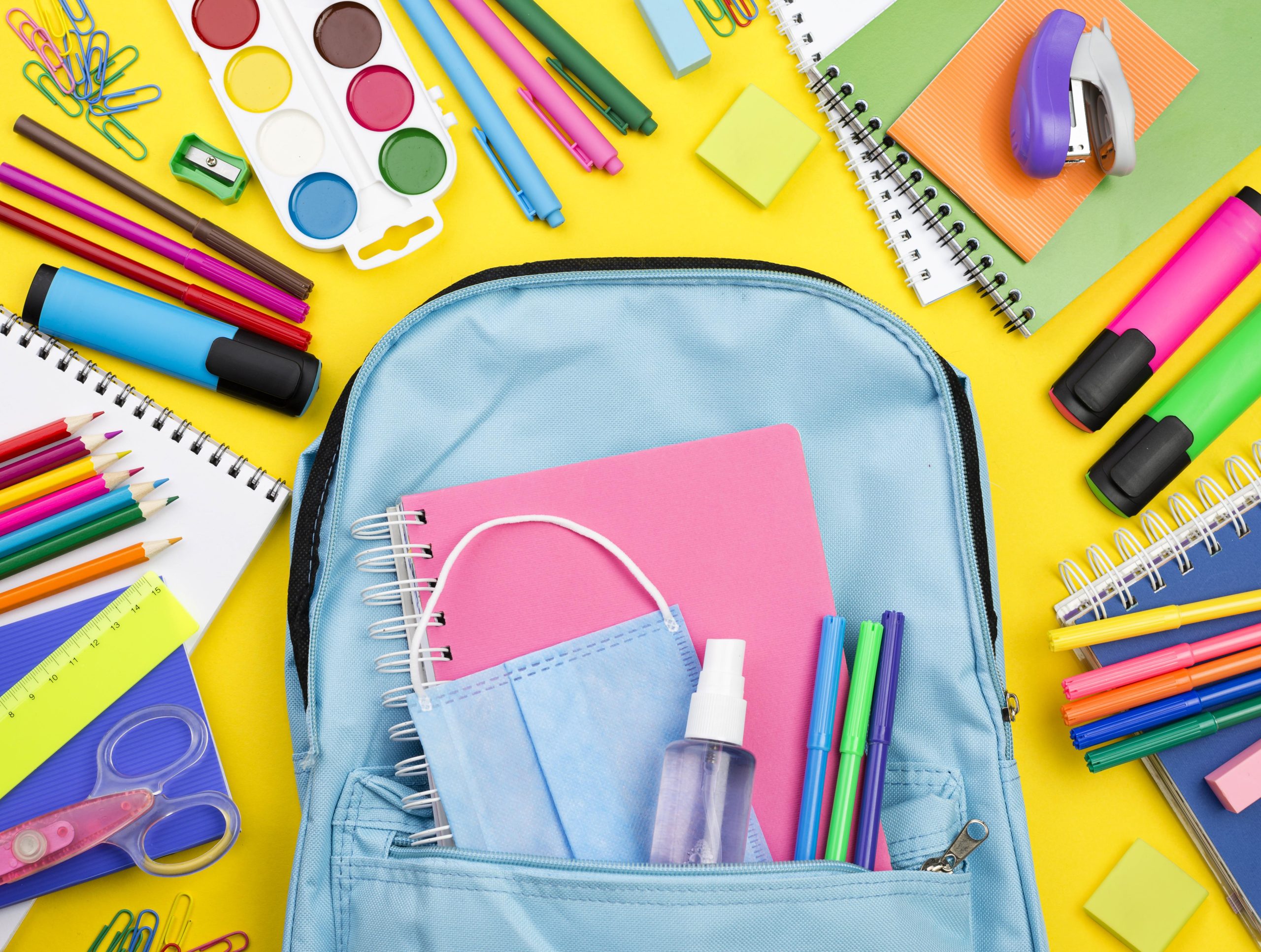 flat-lay-school-essentials-with-multicolored-pencils-backpack